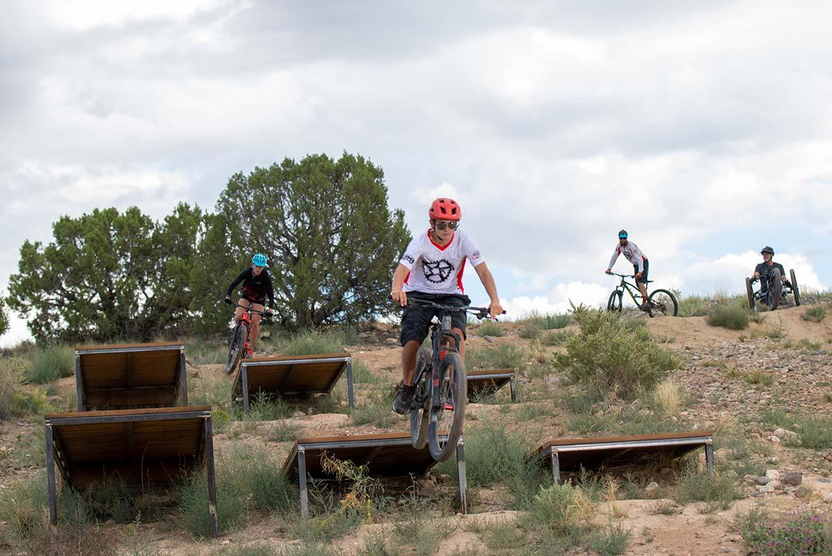 Male riding his mountain bike at the San Juan College Bike Park.